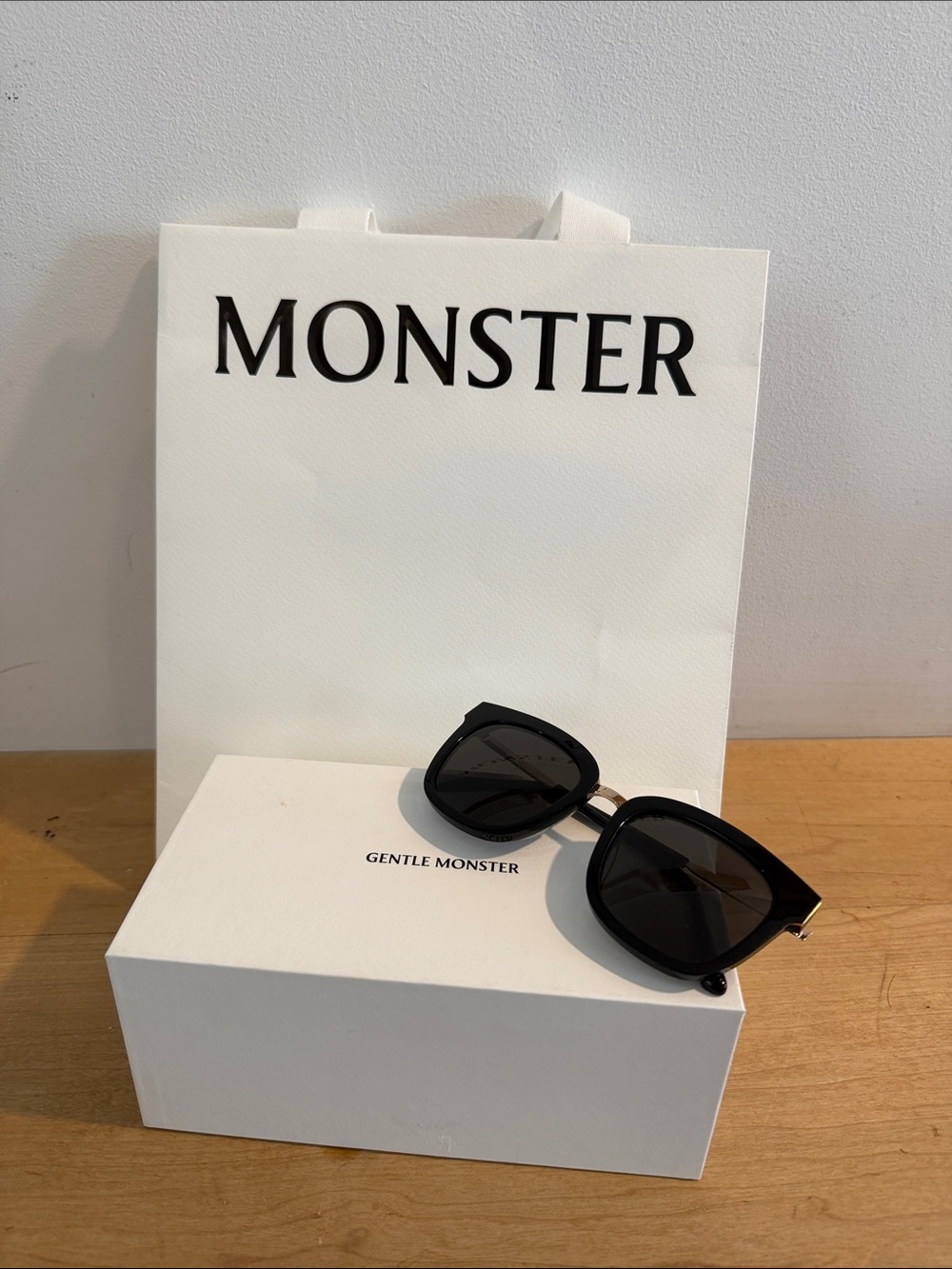 Gentle Monster Black Sunglasses with gold metal accents